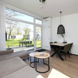 The Woonkamer of Type Forest Cabin Wellness 4 - nr. 129 in Roompot Vakantiepark Schaijk