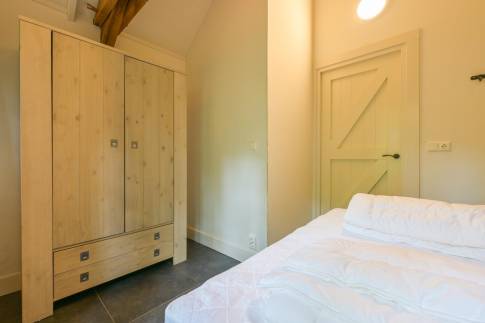 The Slaapkamer 1 of nr. V1 - type Boerderij Villa in Bospark Vlindervallei