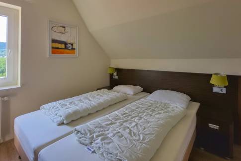 The Slaapkamer 3 of nr. 070 - type Villa Edersee Luxe in Dormio Resort Eifeler Tor