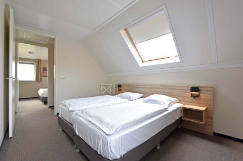 The Slaapkamer 3 of nr. 137 - type 6EL in Dormio Strand Resort Nieuwvliet-Bad