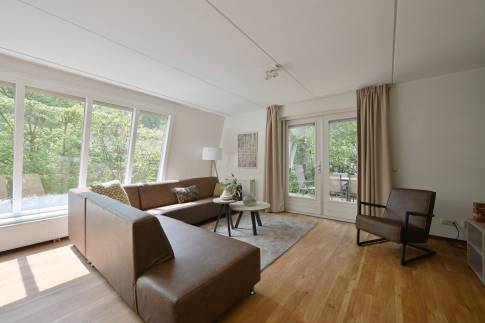 The Woonkamer of nr. 114 Kamperfoelie - type Bosvilla Comfort 6-7 in Landal Bungalowpark Hoenderloo