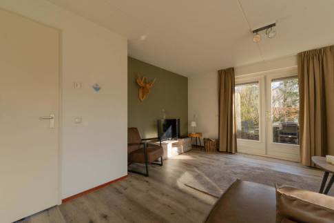 The Woonkamer of Type Bosvilla Comfort 6-7 - nr. 16 Moerbei in Landal Bungalowpark Hoenderloo