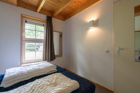 The Slaapkamer 1 of nr. 003 - type 8C Boerenhoeve in Landal Landgoed De Hellendoornse Berg