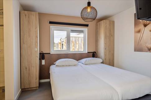The Slaapkamer 2 of Type Strandlodge 8 - nr. 14 in Vakantiepark Boomhiemke