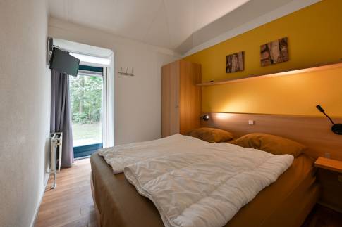 The Slaapkamer 1 of nr. 040 - type 4CK in Landal Stroombroek