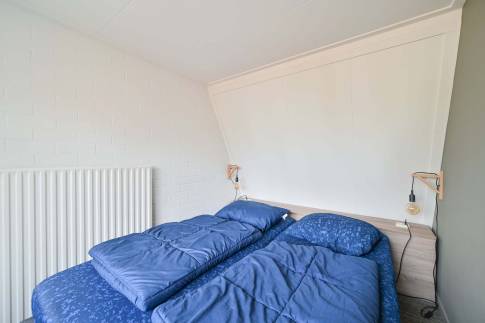 The Slaapkamer 2 of Type Veluwe Villa 4B - nr. 73 Pijplook in Landal Bungalowpark Hoenderloo