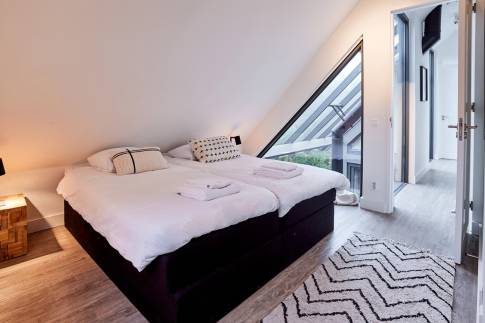 The Slaapkamer 3 of Type 8-persoons Wellness Tub & Sauna - nr. 13 in Vakantiepark Duynvoet