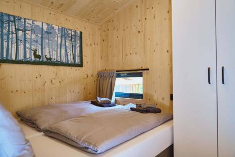 The Slaapkamer 1 of Type Boomwoning Luxe 4P - nr. I07 in UplandParcs Sauerland
