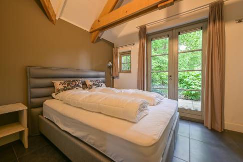 The Slaapkamer 1 of nr. V1 - type Boerderij Villa in Bospark Vlindervallei