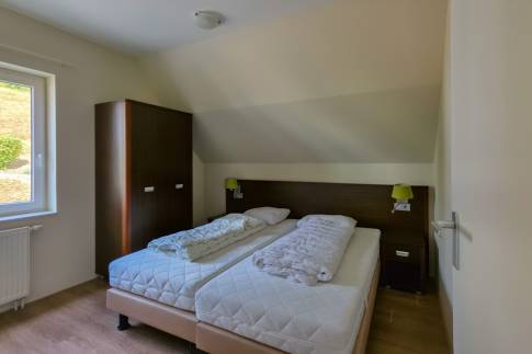 The Slaapkamer 1 of nr. 070 - type Villa Edersee Luxe in Dormio Resort Eifeler Tor