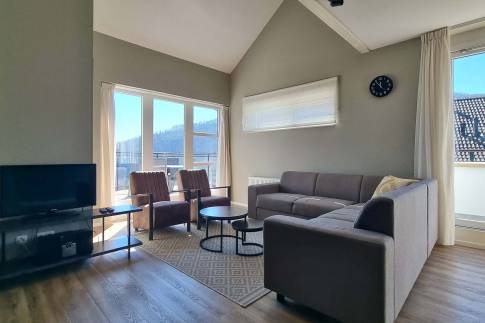 The Woonkamer of Type Penthouse Staffelsee Extra Luxe - nr. 123 in Dormio Resort Eifeler Tor