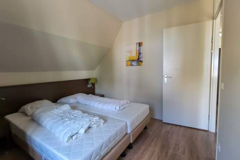 The Slaapkamer 1 of nr. 070 - type Villa Edersee Luxe in Dormio Resort Eifeler Tor