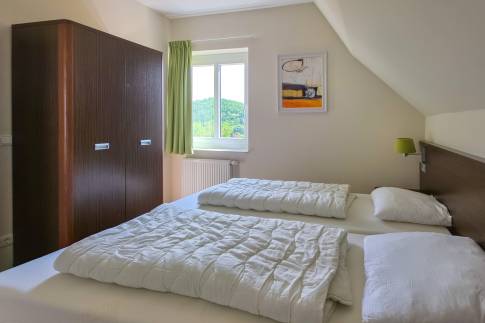 The Slaapkamer 3 of nr. 070 - type Villa Edersee Luxe in Dormio Resort Eifeler Tor